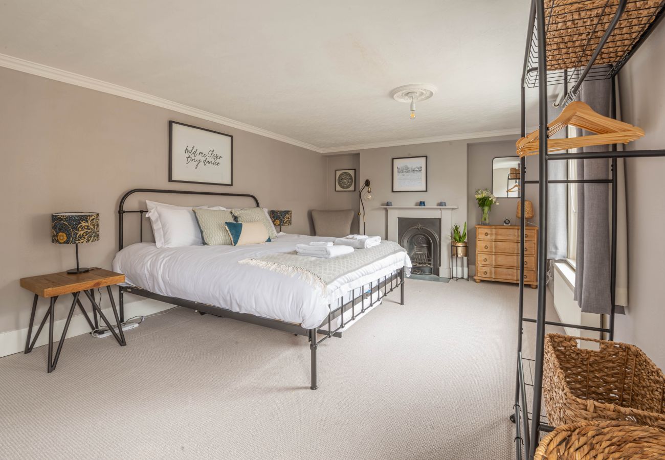 Spacious principal king bedroom with clothes rail