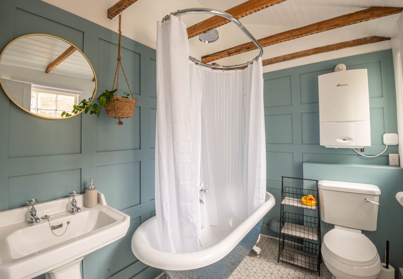 Bathroom with shower, basin and painted panelling