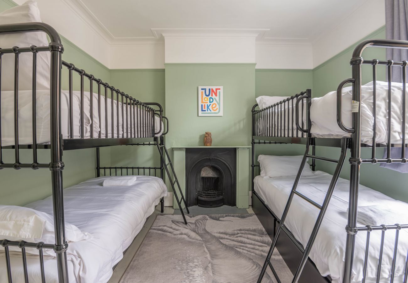 Children's room with four sturdy single bunk beds