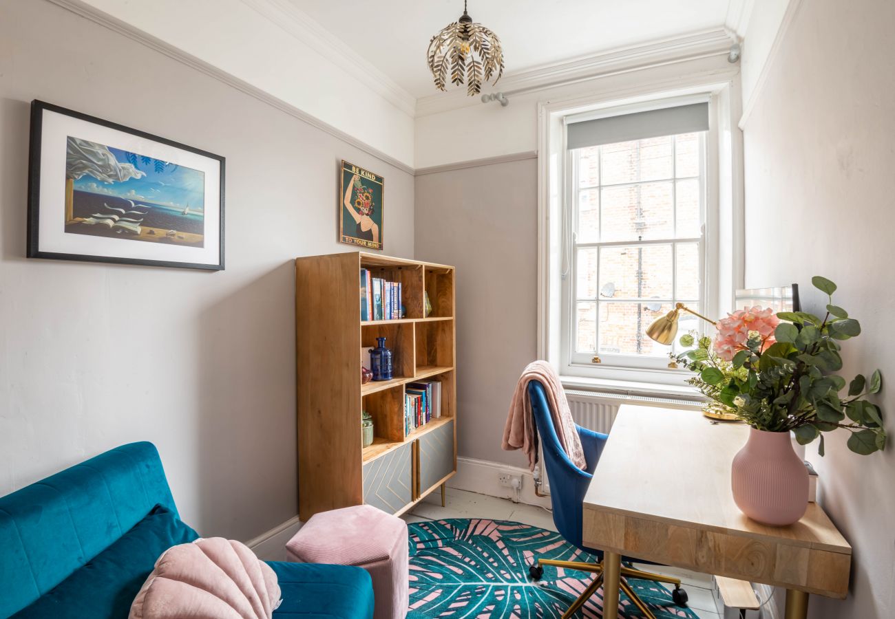 Private study with desk, chair and sash window