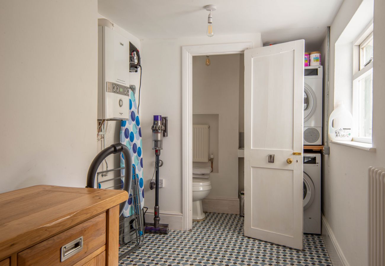 Bright laundry room with washing facilities